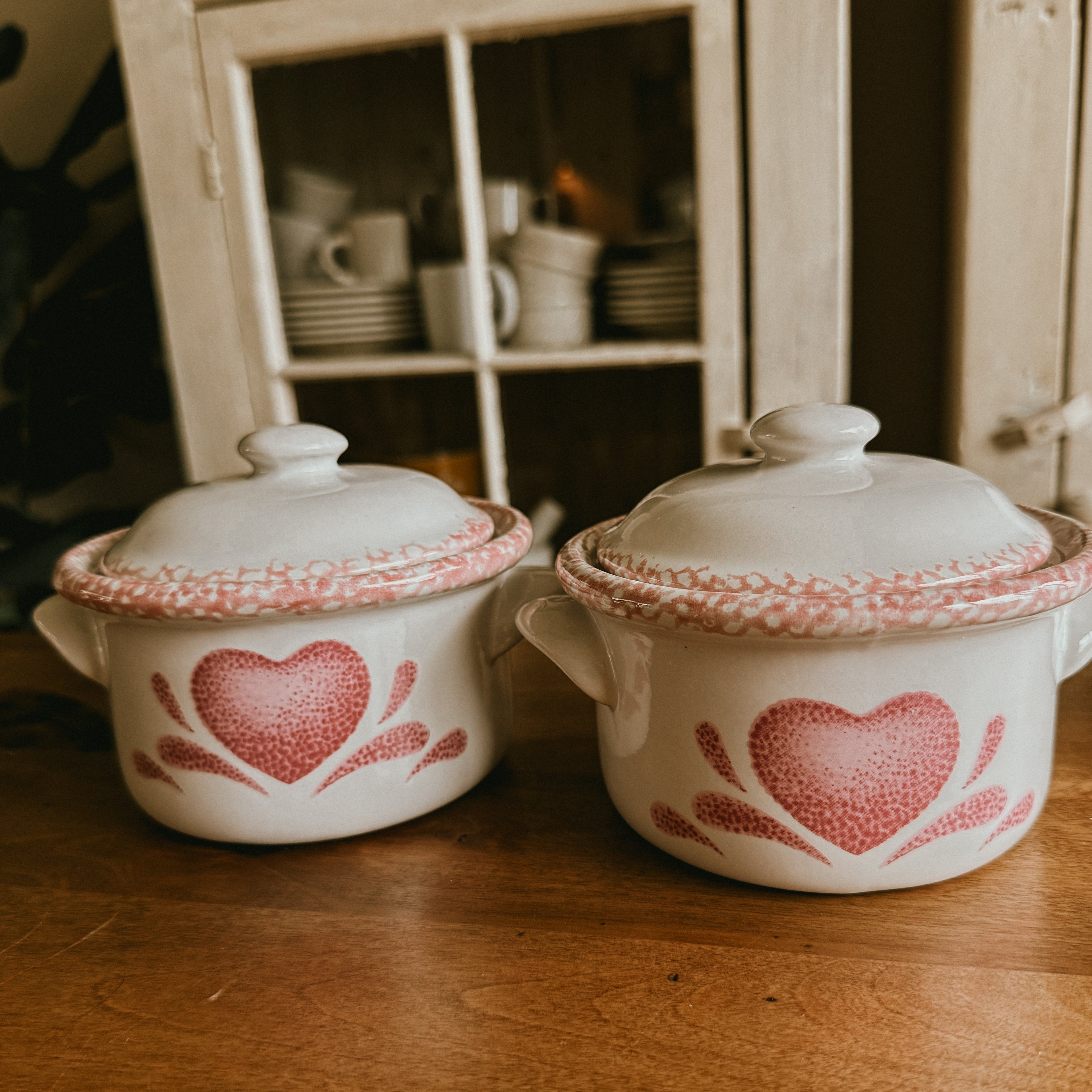 Two Pink spongeware ceramic pots with heart designs and lids 5"